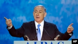 Israeli Prime Minister Benjamin Netanyahu gestures while speaking at the 2015 American Israel Public Affairs Committee (AIPAC) Policy Conference in Washington, D.C., March 2, 2015.