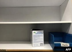 A box of surgical gloves remains on the shelves of the pharmacy at the Dr. Miguel Perez Carreno Hospital, in the west of Caracas, Venezuela, Dec. 31, 2018.