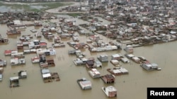 This handout photo from the Iranian president's office shows an aerial view of flooding in Golestan province, Iran, March 27, 2019.