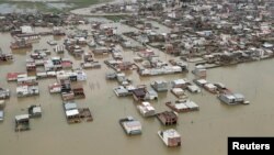 FILE - This handout photo from the Iranian president's office shows an aerial view of flooding in Golestan province, Iran, March 27, 2019.