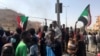 FILE - Protesters gather during what the Information Ministry calls a military coup in Khartoum, Sudan, Oct. 25, 2021. 