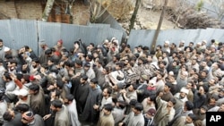 Kashmiri villagers carry the body of Manzoor Magray during his funeral at Chogal village in Handwara town, Kupwara, February 5, 2011