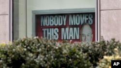 A poster featuring Bill O'Reilly is displayed at the News Corp. headquarters building in Midtown Manhattan, April 19, 2017. Bill O'Reilly has lost his job at Fox News Channel following reports that five women had been paid millions of dollars to keep quiet about harassment allegations. 