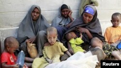 Newly arrived refugees from Barane in Lower Shabelle region in Somalia, rest in the Kenya-Somalia border town of Liboi July 29, 2011. (Reuters)