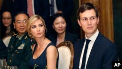 FILE - Ivanka Trump, second from right, the daughter and assistant to President Donald Trump, is seated with her husband, White House senior adviser Jared Kushner, right, during a dinner with President Donald Trump and Chinese President Xi Jinping at Mar-