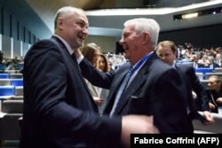 SWITZERLAND -- Russian anti-doping agency (RUSADA) director general Yury Ganus (L) meets World Anti-Doping Agency (WADA) president Craig Reedie at the opening of the 2018 edition of the WADA Annual Symposium in Lausanne, March 21, 2018