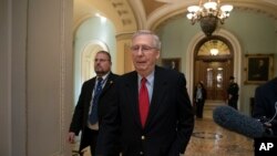 Senate Majority Leader Mitch McConnell, R-Ky., walks from the chamber to his office as the GOP overhaul of the tax bill nears a vote, on Capitol Hill in Washington, Friday, Dec. 1, 2017.