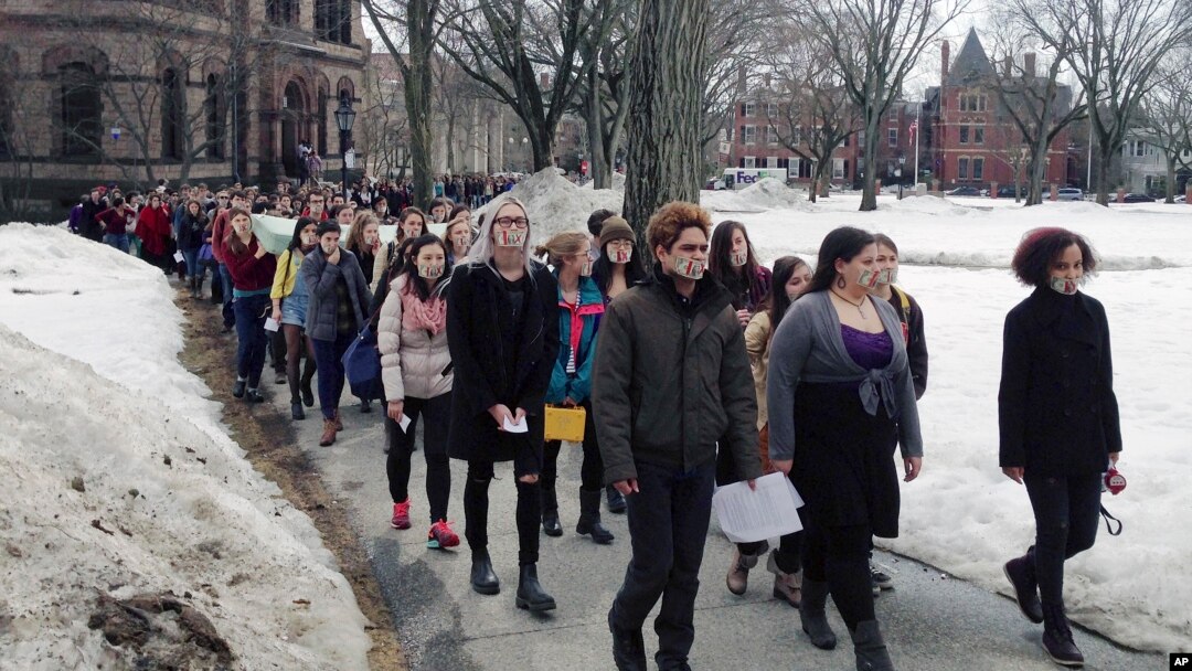 Hundreds of Brown University students march across campus, Wednesday, March 11, 2015, in Providence, R.I., to protest how the college handled recent sexual assault allegations. (AP Photo/Amy Anthony)