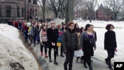 Hundreds of Brown University students march across campus, Wednesday, March 11, 2015, in Providence, R.I., to protest how the college handled recent sexual assault allegations. (AP Photo/Amy Anthony)