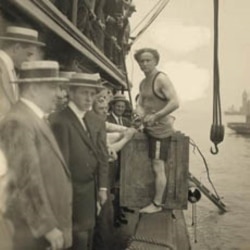 Harry Houdini prepares to be closed in the crate and lowered into the New York Harbor.