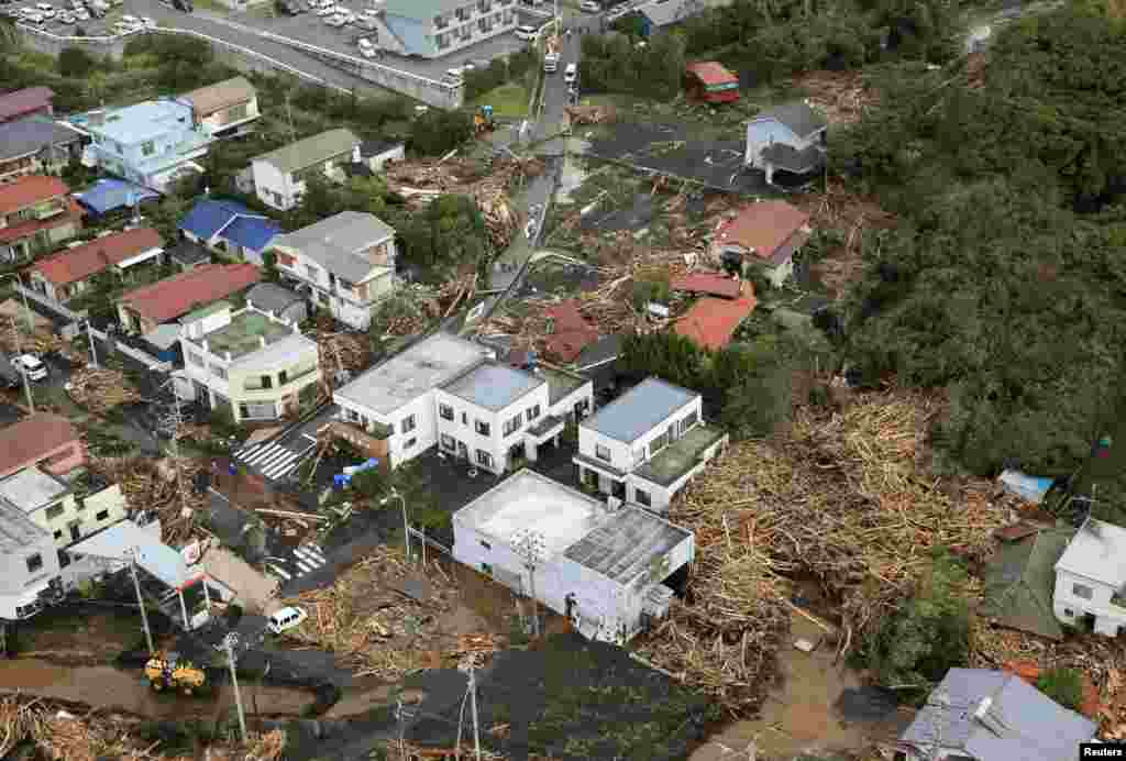 An aerial view shows collapsed houses following a landslide caused by Typhoon Wipha on Izu Oshima island, south of Tokyo, in this photo taken by Kyodo, Oct. 16, 2013.