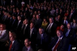 The audience listens as Democratic presidential nominee Hillary Clinton and Republican presidential nominee Donald Trump answers a question during the third presidential debate at UNLV in Las Vegas, Oct. 19, 2016.