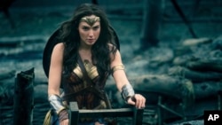 FILE - This image released by Warner Bros. Entertainment shows Gal Gadot in a scene from "Wonder Woman." 