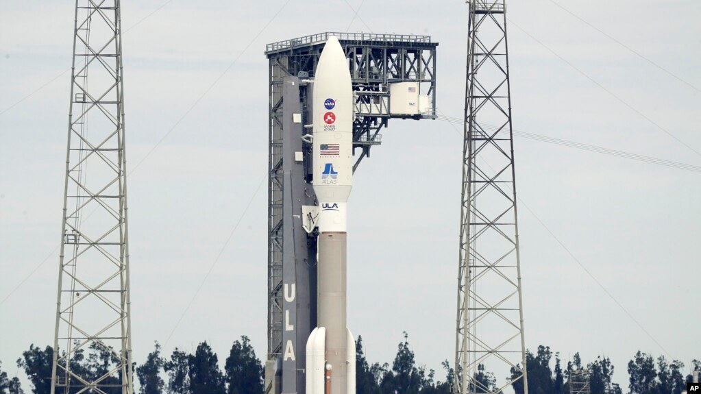 A United Launch Alliance Atlas V rocket that will launch to Mars arrives at Space Launch Complex 41 at the Cape Canaveral Air Force Station, Tuesday, July 28, 2020, in Cape Canaveral, Fla. (AP Photo/John Raoux)