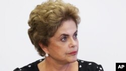 Brazil's President Dilma Rousseff listems in during a meeting at the Planalto Presidential Palace, in Brasilia, April 13, 2016.
