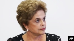 FILE - Brazil's President Dilma Rousseff listems in during a meeting at the Planalto Presidential Palace, in Brasilia, April 13, 2016.