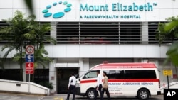 An ambulance is parked outside the Mount Elizabeth Hospital in Singapore, December 27, 2012.