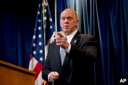 FILE - Then-Acting Director for U.S. Immigration and Customs Enforcement Thomas Homan takes a question from a reporter at a Department of Homeland Security news conference in Washington, Dec. 5, 2017.