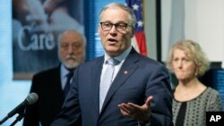 Washington Gov. Jay Inslee speaks, Dec. 11, 2018, at Navos Mental Health and Wellness Center in Burien, Wash. Inslee is launching an initiative to pardon people with one misdemeanor marijuana conviction.