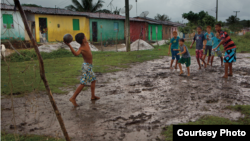 Boys playing soccer. Photo by Caio Vilela.