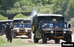 FILE - A U.S. soldier is seen during decontamination exercises in Yeoncheon, about 65 km north of Seoul, May 16, 2013.