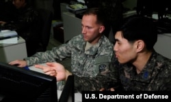 FILE - U.S. and South Korean military officers conduct air and missile defense operations at Osan Air Base, South Korea, during a joint exercise on March 14, 2016.