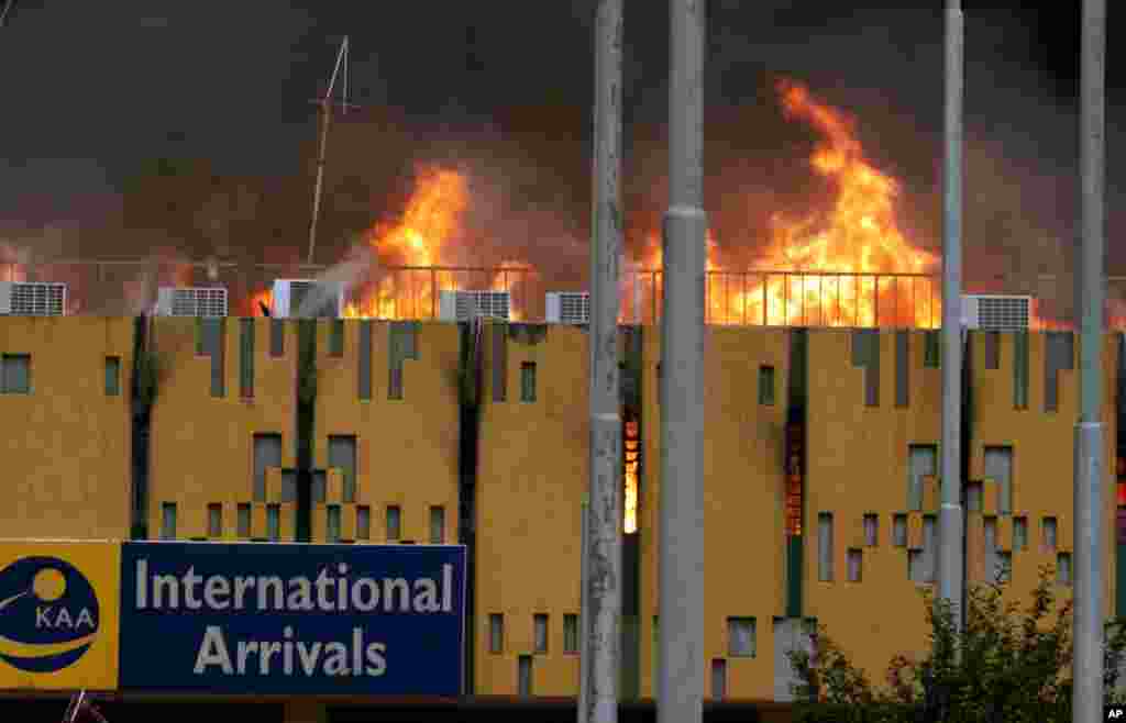 A blaze rages at the arrivals hall at the Jomo Kenyatta International Airport in Nairobi, August 7, 2013. 