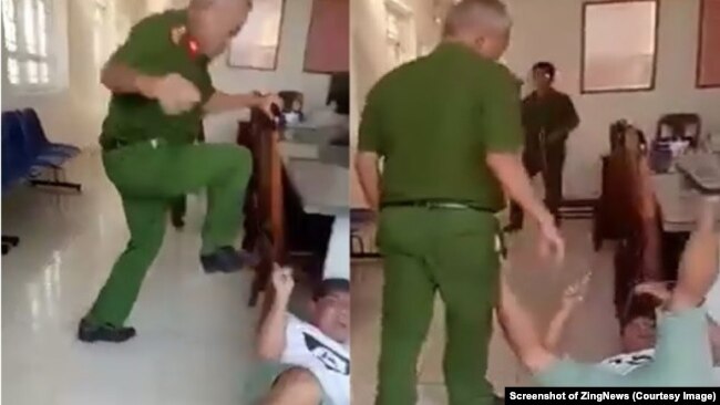 Trung tá Huỳnh Minh Lễ, Phó công an phường Phú Thạnh, dùng chân đạp người làm chứng đang nằm trên nền trụ sở công an phường. (Ảnh chụp màn hình Zing News)