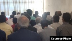 Minority Iranian Sunni Muslims gather at a prayer center in this photo published by state-affiliated news site Shafaqna as part of an Aug. 23, 2018, report about police blocking Sunni prayer centers in the capital, Tehran, on the festival of Eid al-Adha.