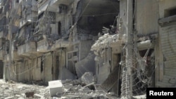 Damaged buildings in Aleppo's district of Salah Edinne, August 3, 2012. 