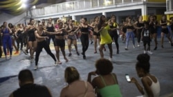 In this Jan. 15, 2020 photo, performers of the Paraiso do Tuiuti samba school practice in Rio de Janeiro, Brazil. (AP Photo/Silvia Izquierdo)