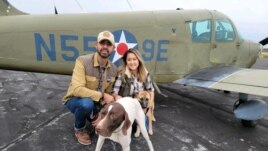 Pilot Eduard Seitan and his fiancee, Debbie, in front of his plane. They are preparing to deliver rescue dogs to their new home.