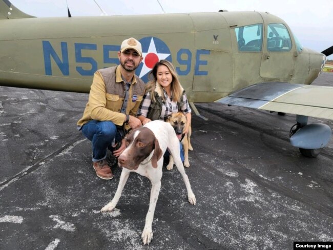 Pilot Eduard Seitan and his fiancee, Debbie, in front of his plane. They are preparing to deliver rescue dogs to their new home.