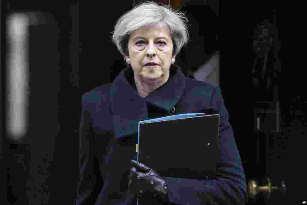 Britain's Prime Minister Theresa May leaves 10 Downing Street in London on her way to parliament, March 23, 2017, following the attack in London Wednesday.