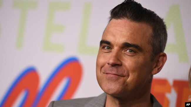 Ngôi sao nhạc pop người Anh Robbie Williams (ảnh), nữ nghệ sĩ opera người Nga Aida Garifullina và cựu danh thủ Ronaldo của Brazil sẽ là những nhân vật chính trong lễ khai mạc.