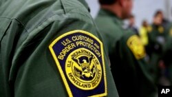 FILE - Border Patrol agents hold news conference prior to a media tour of a new U.S. Customs and Border Protection temporary facility in Donna, Texas, May 2, 2019.