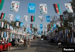 Election posters of parliamentarian candidates are installed during the elections campaign in Kabul, Afghanistan, Sept. 30, 2018. The parliamentarian elections will be Oct. 20, 2018.