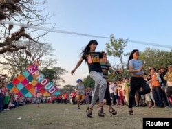 People take part in the Stiletto race of the Drag Olympics at Yangon Pride festival in Yangon, Myanmar, January 27, 2019.