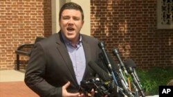 In this frame from video, Jason Kessler, a blogger based in Charlottesville, Va., speaks to the media, Aug. 13, 2017. Kessler, who organized the rally in Charlottesville on Saturday that sparked violent clashes between white supremacist groups and counter-protesters tried to hold a news conference, but a crowd booed him and forced him away from the lectern.