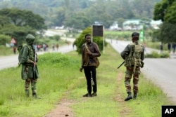 FILE: Soldiers patrol the streets as protestors gather during a demonstration over the hike in fuel prices in Harare, Zimbabwe, Tuesday, Jan. 15, 2019.