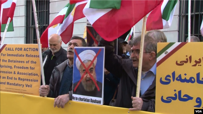 Iranian American protesters chant "Death to Khamenei" and "Death to Rouhani" as Iran's foreign minister Mohammad Javad Zarif appears at the Council on Foreign Relations in New York, April 23, 2018.