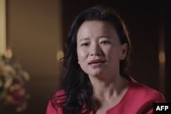 Gambar file tak bertanggal dari video handout oleh Departemen Luar Negeri dan Perdagangan Australia (DFAT) / Alumni Global Australia pada 1 September 2020 menunjukkan jurnalis Australia Cheng Lei di lokasi yang tidak diketahui. (AFP)