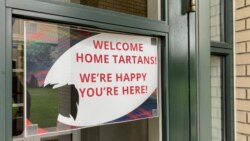 A sign on the campus of Carnegie Mellon University welcoming back students.