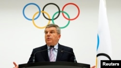 International Olympic Committee (IOC) President Thomas Bach announces the 2022 Olympic Winter Games candidate cities at the IOC headquarters in Lausanne, Switzerland, July 7, 2014.