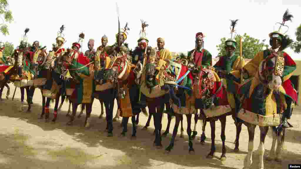 Horsemen pay homage to Emir of Kano Alhaji Ado Bayero during an event marking his 50th year on the throne.