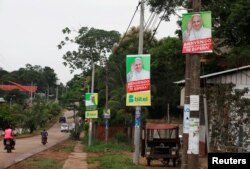 Posters of Pope Francis hang on lamp posts along a street in Puerto Maldonado, ahead of the papal's visit to Peru, Jan. 18, 2018.