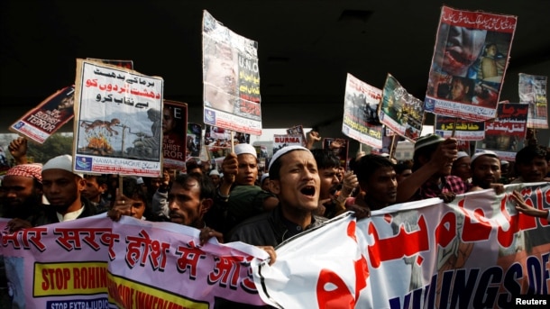 FILE - Rohingya Muslim refugees shout slogans during a protest against what organizers say is the crackdown on ethnic Rohingyas in Myanmar, in New Delhi, India, Dec. 19, 2016.