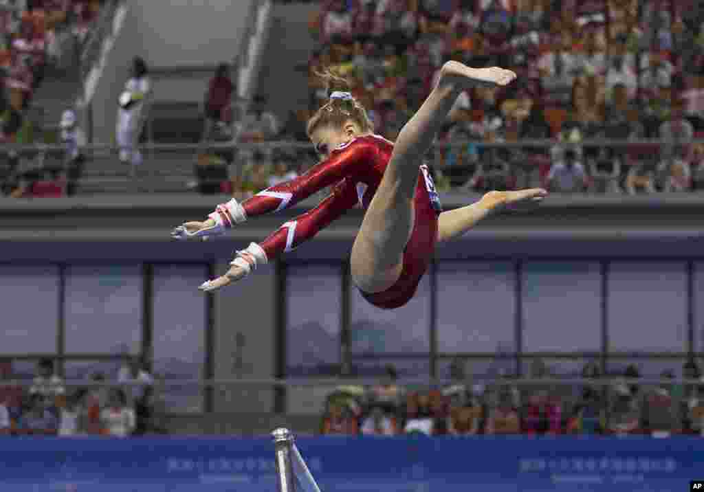 Switzerland's Ilaria Kaeslin leaps from the uneven bars as she competes in the women's qualifying round of the Artistic Gymnastics World Championships at the Guangxi Gymnasium in Nanning, capital of southwest China's Guangxi Zhuang Autonomous Region.