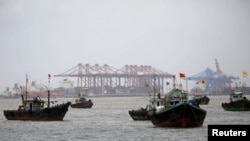 FILE - Fishing trawlers are seen in front of the Jawaharlal Nehru Port Trust (JNPT) in Mumbai, India.