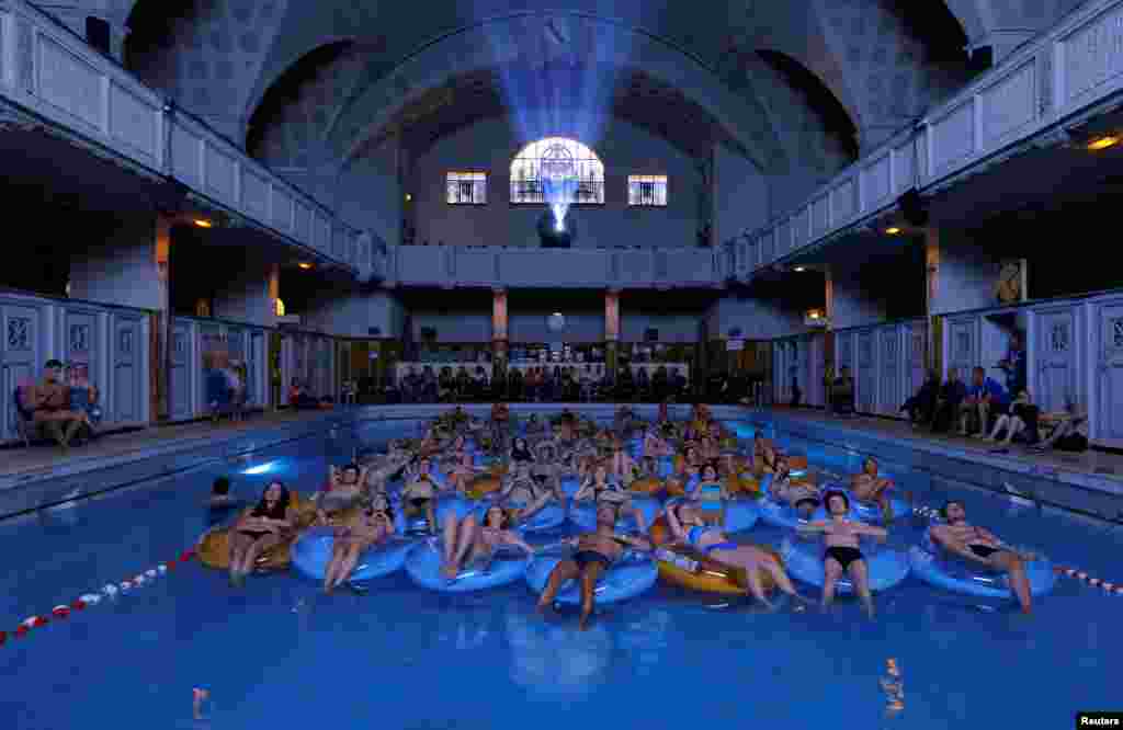 People attend the screening of the film Jaws by director Steven Spielberg, at Strasbourg public baths during the European Fantastic Film Festival, in Strasbourg, France, Sept. 18, 2016.